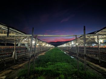 View of railroad station against sky at night