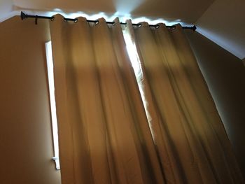 Low angle view of illuminated lighting equipment