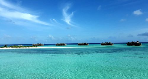 Scenic view of sea against blue sky