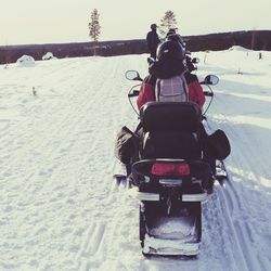 People on snow covered landscape