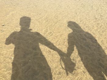 High angle view of people standing on field