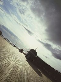 Low angle view of cars on sea against sky