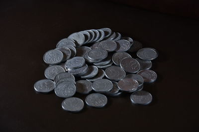 High angle view of coins on table