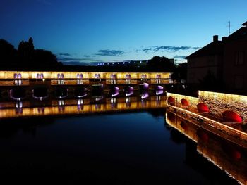 Reflection of illuminated buildings in water at night