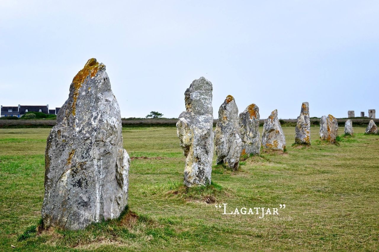 grass, old ruin, clear sky, history, ancient, the past, built structure, field, architecture, sky, famous place, travel destinations, old, ancient civilization, landscape, archaeology, grassy, stone material, tranquility, tourism