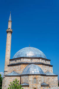 Low angle view of a building against blue sky