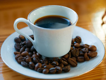 Close-up of coffee cup on table