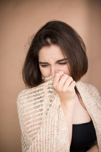 Close-up of woman suffering from cold