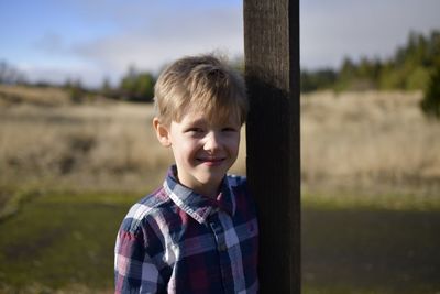 Portrait of boy standing outdoors