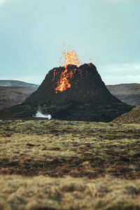 Scenic view of volcanic landscape against sky