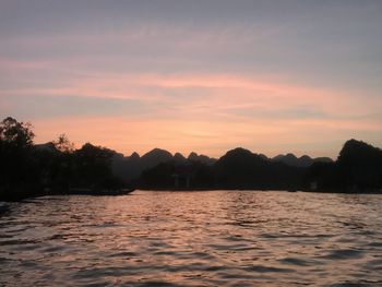 Scenic view of lake against sky during sunset