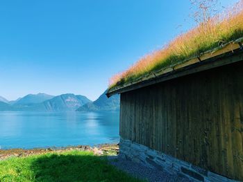 Norwegian landscape, along the fjord, horizon over the sea and mountains on a sunny day, clear  sky