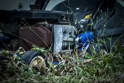 Close-up of abandoned truck on field