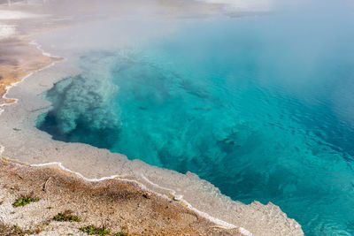 Brilliant blue thermal pool in west thumb basin in yellowstone national park