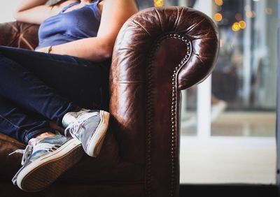 Low section of man sitting outdoors