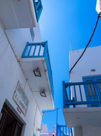 Low angle view of buildings against blue sky