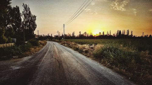 Empty road at sunset