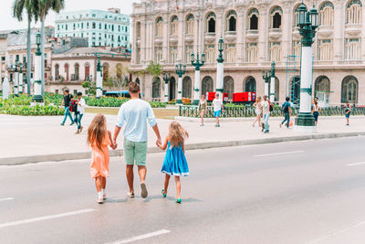 People walking on street in city