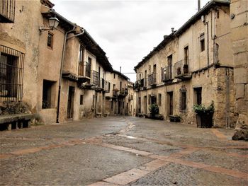 Narrow street amidst buildings in town