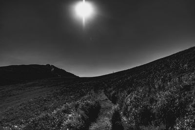 Low angle view of land against sky at night