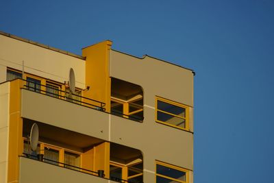 Low angle view of building against blue sky