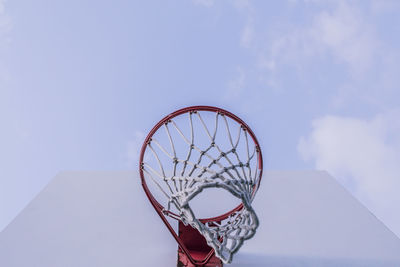 Low angle view of basketball hoop against sky