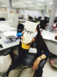 Midsection of woman holding ice cream