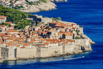 High angle view of town by sea