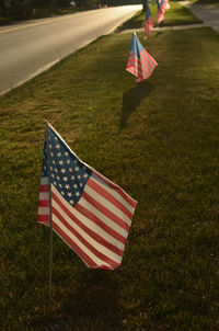 High angle view of american flags on grass by street