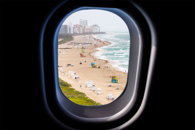 Airplane wing seen through window