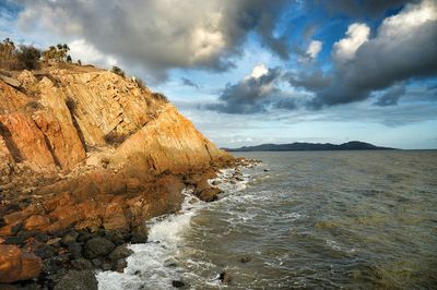 Scenic view of sea against cloudy sky