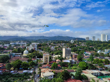 High angle view of buildings in city against sky