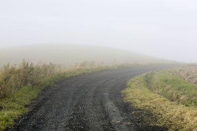 Road passing through field