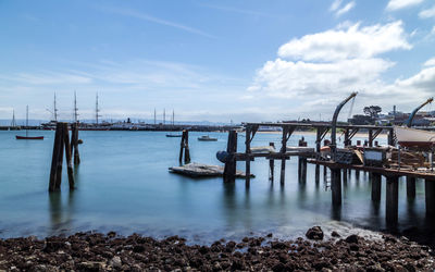 Pier over sea against sky