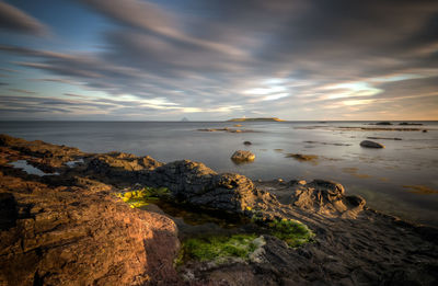 Scenic view of sea against sky during sunset