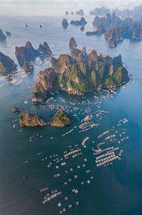 High angle view of floating platform and mountains in sea