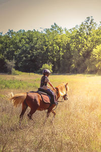 Girl riding horse