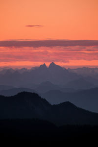 Scenic view of silhouette mountains against sky during sunset