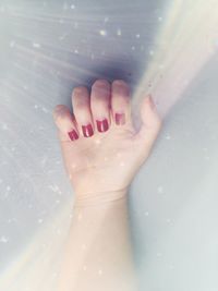 Close-up of woman hand with painted nails