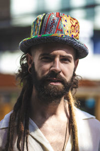 Close-up portrait of man wearing hat