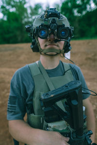 Mid adult man holding camera