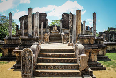 Steps leading towards temple against sky