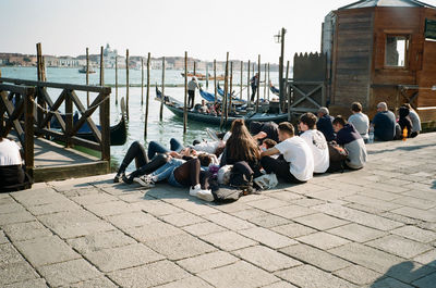 Group of people sitting on the beach