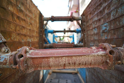 Close-up of rusty pipe against wall
