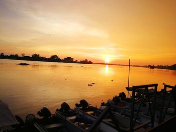 Scenic view of sea against orange sky