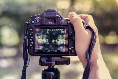 Close-up of hand photographing