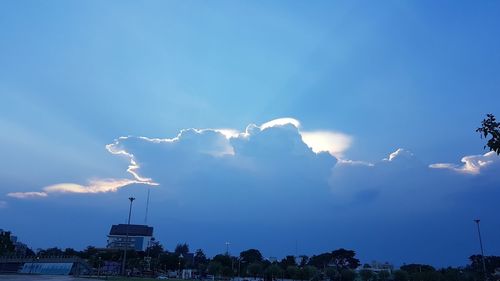 Low angle view of building against cloudy sky