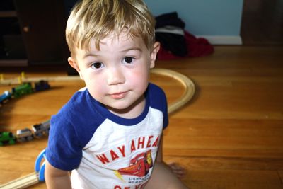 Portrait of boy sitting at home