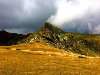 View of mountain range against cloudy sky