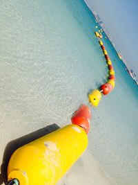 High angle view of rope floating on sea